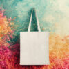 Plain natural-colored cotton tote bag with long handles on a white background.