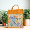 Eco-friendly yellow jute tote bag with floral canvas front pocket and zipper