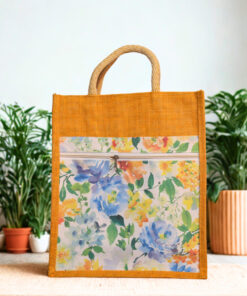 Eco-friendly yellow jute tote bag with floral canvas front pocket and zipper