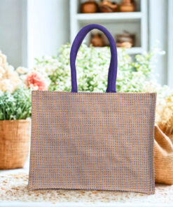 Textured jute tote bag with blue handles and a natural beige body.
