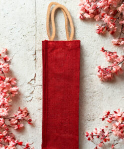 Plain red jute bottle bag with sturdy cotton rope handles, ideal for single bottle gifting or retail use.