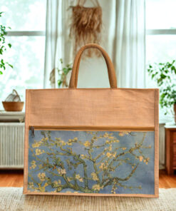 A rectangular juco (jute and cotton blend) tote bag with shorter brown handles and a zippered top. The lower portion of the bag features a printed image resembling Vincent van Gogh's "Almond Blossoms" on a light blue background