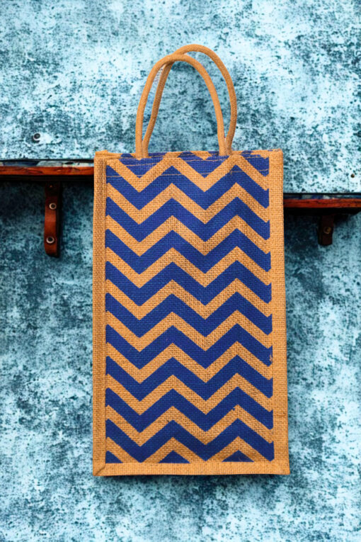 A medium-sized rectangular jute bag with a bold, repeating blue and natural jute chevron (zigzag) pattern.