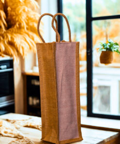 Eco-friendly jute bottle bag with soft pink herringbone panel and natural jute handles.