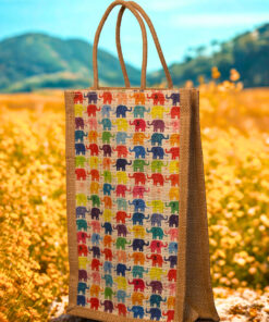 A medium-sized rectangular jute bag featuring a repeating grid pattern of small, colorful elephants.