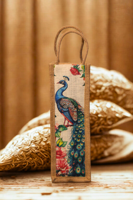 A tall, narrow jute bag with an illustrated peacock and floral design on the front.