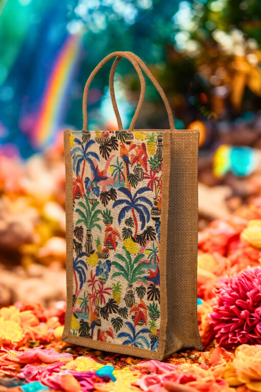 A medium-sized rectangular jute bag featuring a vibrant and detailed tropical print with palm trees, birds, and flowers.