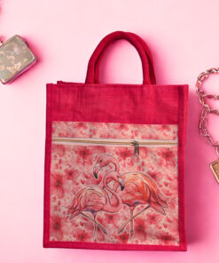 Bright pink jute bag with a floral flamingo print and front zipper pocket