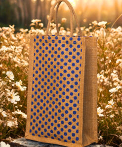 A medium-sized rectangular jute bag with a pattern of evenly spaced blue polka dots on a natural jute background.