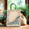 Canvas tote bag with two peacocks surrounded by a floral arch in pastel colors