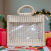 Small striped jute bag with clear plastic front window and woven handles.