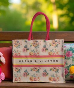 Floral printed tote bag with bold pink handles and "Urban Rivington" branding across a striped band.