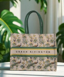 A canvas tote bag with a peacock and foliage print