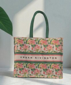 A canvas tote bag with a pink lotus flower print