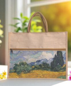 A rectangular juco (jute and cotton blend) tote bag with shorter brown handles and a zippered top. The lower portion of the bag features a printed image resembling Vincent van Gogh's "Wheat Field with Cypresses" with rolling hills