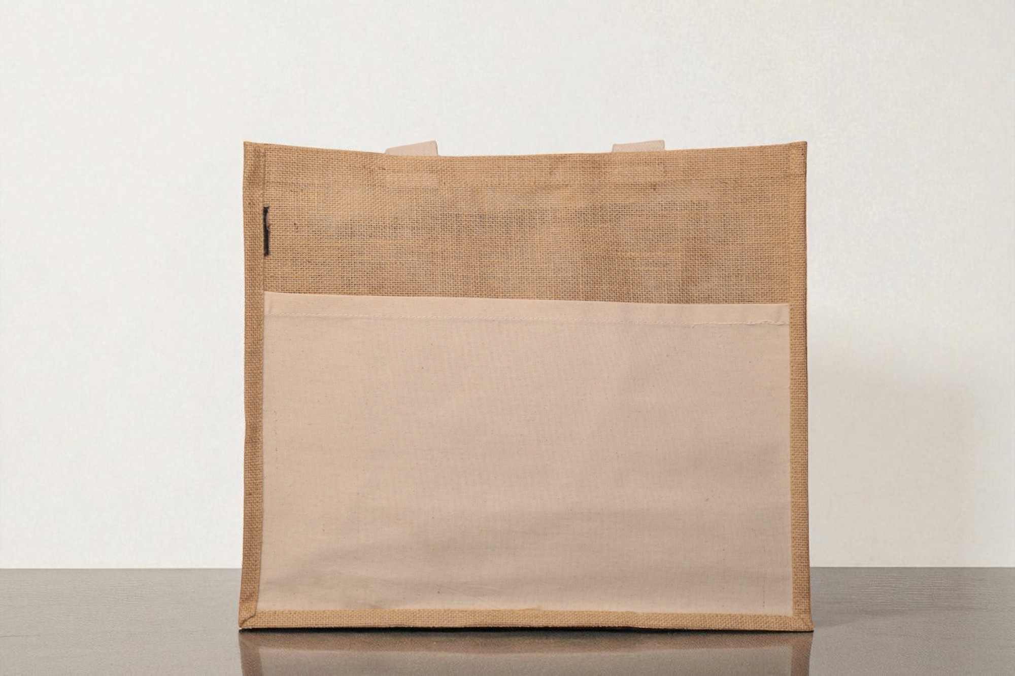 IMG_9727-Photoroom.jpg A rectangular natural brown jute tote bag featuring a large