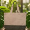 Natural canvas tote bag with a contrasting olive jute base and dual-toned sturdy handles.