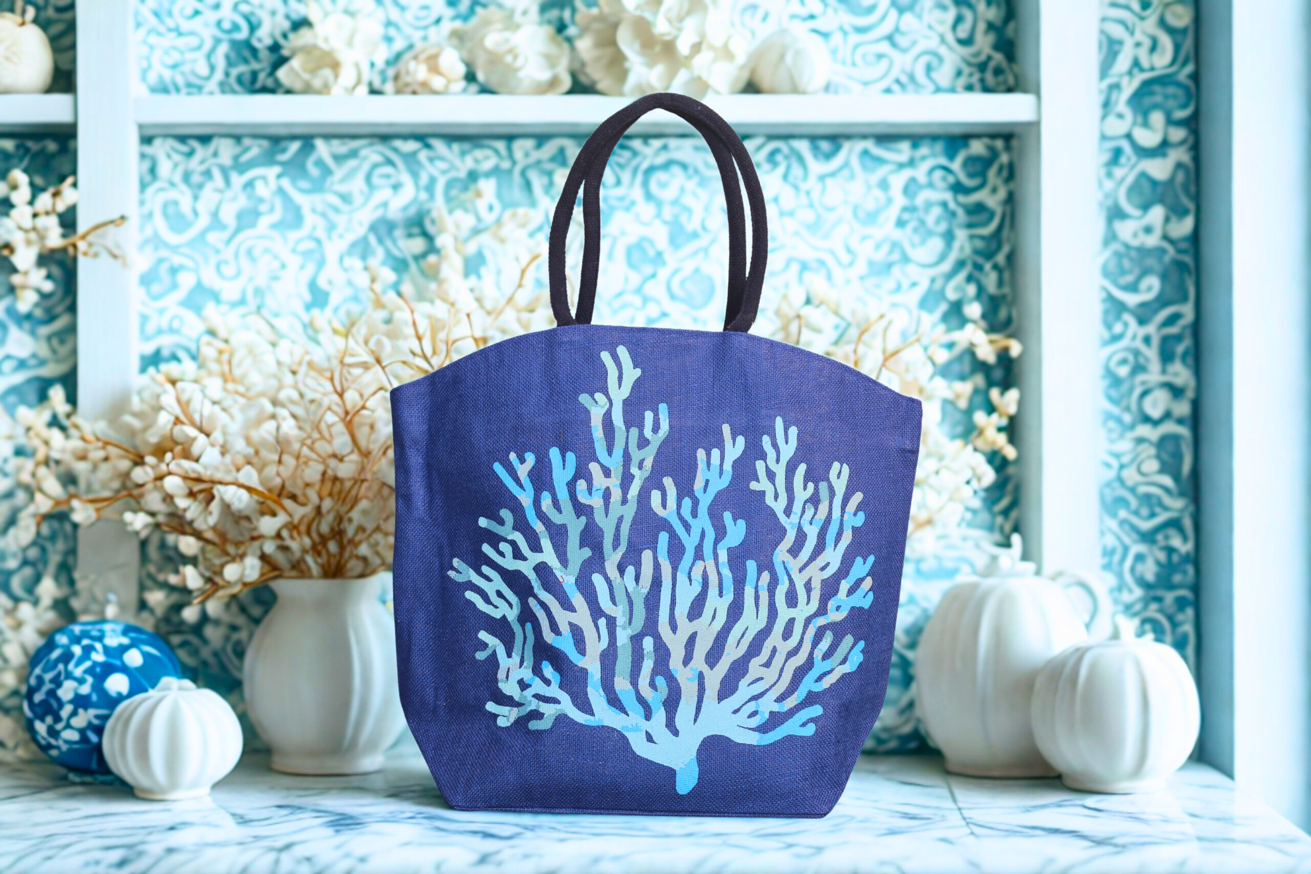 a0afccec-2058-4307-a0e9-26bef46bdd64-scaled-1.jpg Natural jute tote bag with a large dark blue coral design on the front