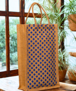 A medium-sized rectangular jute bag with a pattern of evenly spaced blue polka dots on a natural jute background.