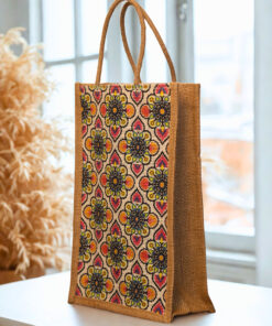 A medium-sized rectangular jute bag with a colorful, repeating geometric and floral-inspired pattern.