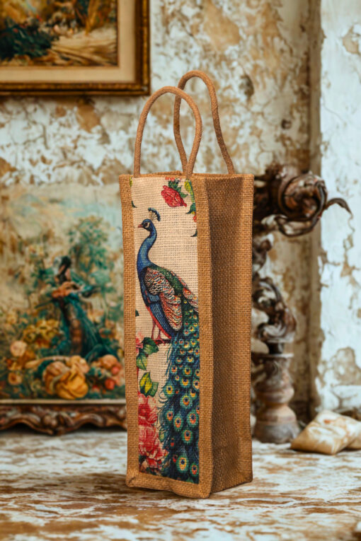 A tall, narrow jute bag with an illustrated peacock and floral design on the front.