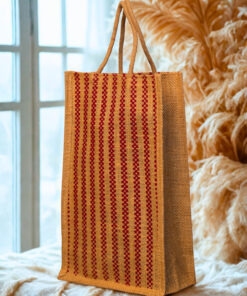 A medium-sized rectangular jute bag with a woven pattern of alternating natural jute and red vertical stripes.